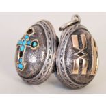 Russian interest: A Russian white and yellow metal egg locket inset with a turquoise cross and with