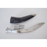 A white metal kukri/khukuri dagger complete with smaller karda blade and chakmak sharpener in a