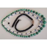 A 20th century graduated malachite and glass bead necklace, 70cmL,