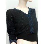 A beautiful 1940s/50s black beaded sweater, neckline and cuffs have denser beading,