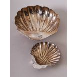 A silver scallop shell dish on spherical feet, 6cmH, 17cmD, Atkin Brothers, Sheffield 1902,