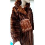 A 1950s/60s lined mid-brown fur coat with an (almost!) matching fur muff/clutch bag.