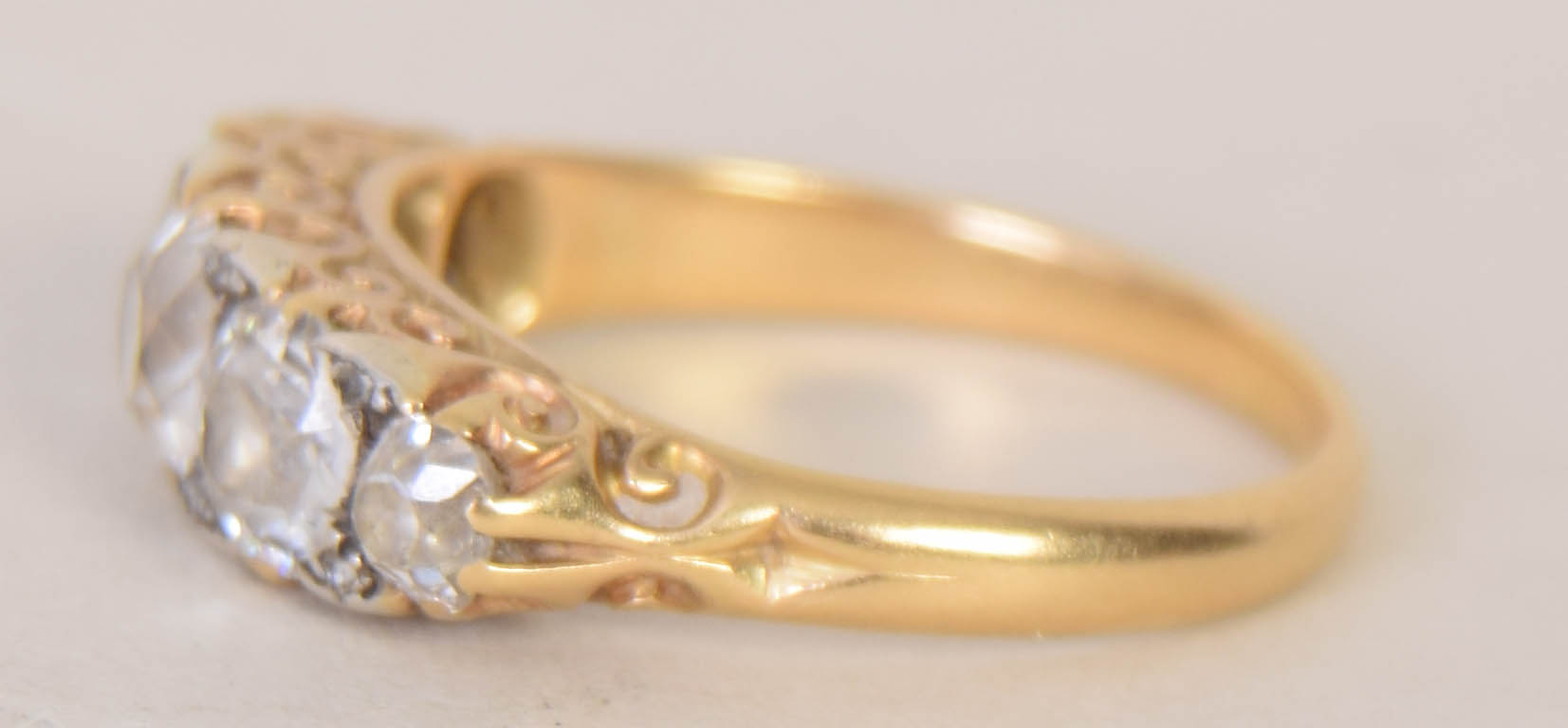 An early 20th century 18ct gold and five stone diamond engagement ring