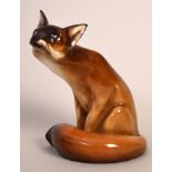 A Royal Doulton figure of a seated fox, serial HM130,