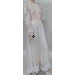 A 1960s/70s 'Gina Fratini' tulle dress. The skirt is lined but the top half is not.