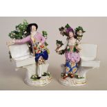 A pair of porcelain bocage figures of male and female gardeners with open hampers,