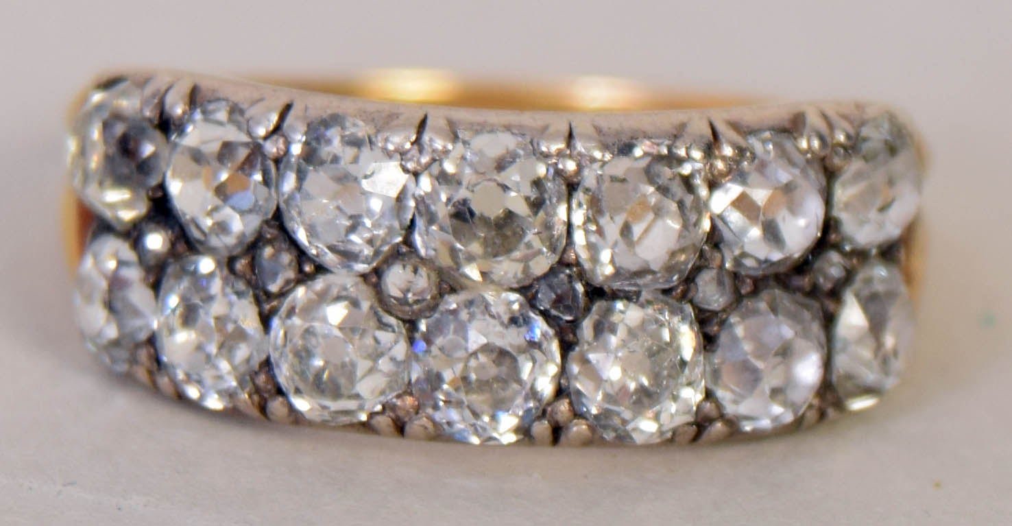 An early 20th century yellow metal and diamond set cluster ring,