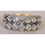 An early 20th century yellow metal and diamond set cluster ring,