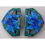 A sterling silver and enamel belt buckle, decorated with blue and green flowers,