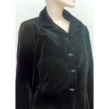 A vintage black velvet 'Jaeger' short fitted jacket size 10/12 and a further plum,