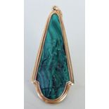 A late 19th century/early 20th century malachite and yellow metal mounted pendant, probably Russian,