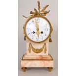 A Louis XIV style gilt and marble clock garniture with trophy crest and enamel dial,