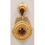 A Victorian yellow metal and citrine brooch with beaded decoration and a crescent shaped pendant