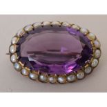 A 19th century amethyst and seed pearl oval brooch