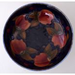 A Moorcroft Tudric fruit bowl decorated on the interior and exterior with peaches,