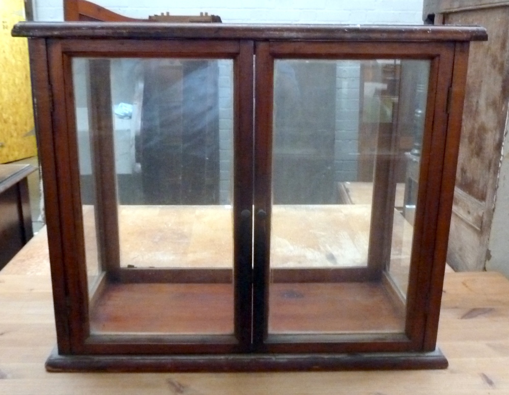 A glass display cabinet 29 x 66 x 56cmH