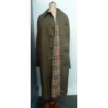 A vintage Burberry raincoat together with an Aquascutum overcoat - to fit 42" chest