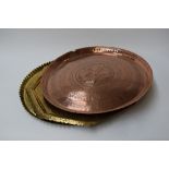 A selection of three copper and brass wall hanging plates/trays with an oriental decoration