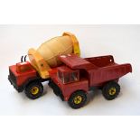 A vintage red Tonka dumper truck together with a Tonka cement mixer