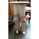 An unusual table with cricketer legs