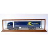 A glass cased car model of Night Freight lorry,