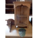 A small pine corner cupboard with one shelf together with two small wall shelves