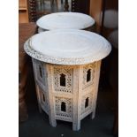 Two white painted Arabic style folding side tables