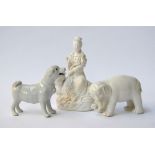 Three ceramic figurines of a dog,