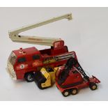 A vintage Tonka fire engine crane together with two others