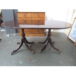 A George III style twin pedestal dining table