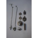 A selection of sterling silver items, including two pendant necklaces, one with a cross,
