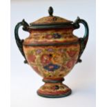 A large two handed ceramic urn decorated with flowers 49cmH