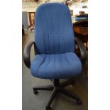 An office chair upholstered in blue fabric