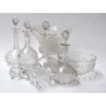A mixed collection of crystal cut glass, including four wine decanters, a flower vase,