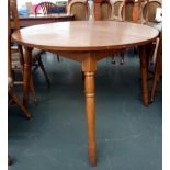 A midcentury circular extending dining table on turned dansette legs 104cmD