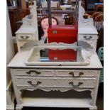 A white painted dressing table with mirror and two short drawers over one long,