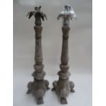 Two large metal candlesticks with foliate scrolls (af)