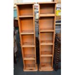 Two thin pine bookshelves
