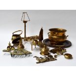 A selection of metal items including plates, candlestick holder,