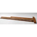 Three vintage wooden rulers