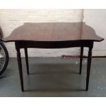 An occasional side table with hinged top, serpentine front,