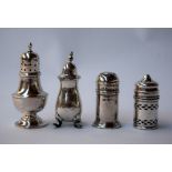 A selection of four sterling silver pepper and salt shakers,