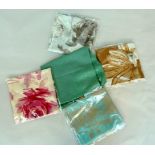 bundle of five new shawls of various colours