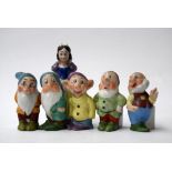 Set of Walt Disney 'Snow White and the Seven Dwarfs' ceramic toothbrush holders, painted and glazed,