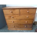 A late 19th century pine chest of drawers two short over three long