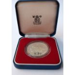 A Guernsey twenty five pence silver jubilee coin,