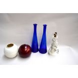 Two blue vases together with a ceramic lamp base,
