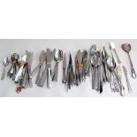 A large collection of EPNS and stainless steel knives, forks and spoons,