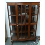 A glazed bow fronted display cabinet of three shelves inlaid with floral and geometric designs (af)