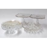Four glass trays and two glass cake stands